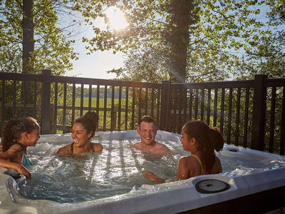 Families relaxing in the hot tub at the end of the day
